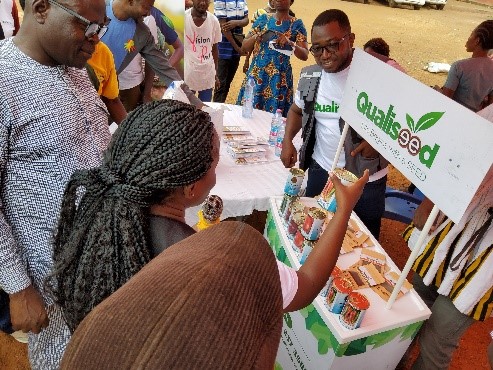 Qualiseed Co Ltd rep. seriously promoting Vegetables seeds at the event